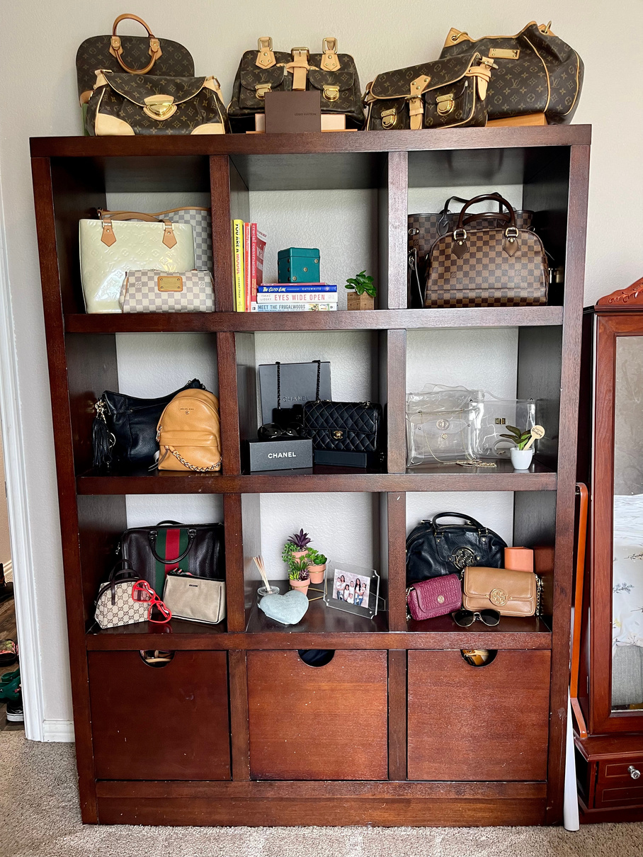 a decluttered and organized a bookcase with purses and other items on it